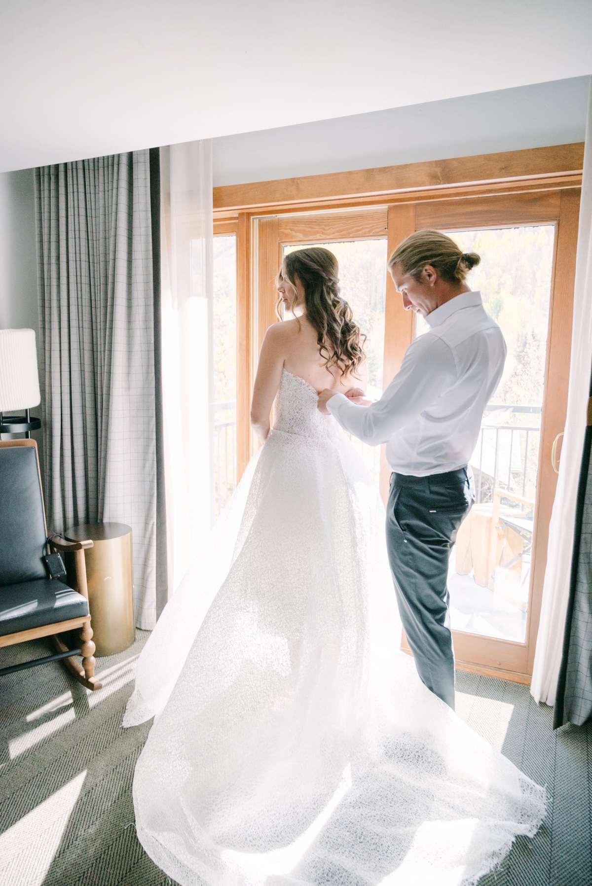 bride and groom getting ready together