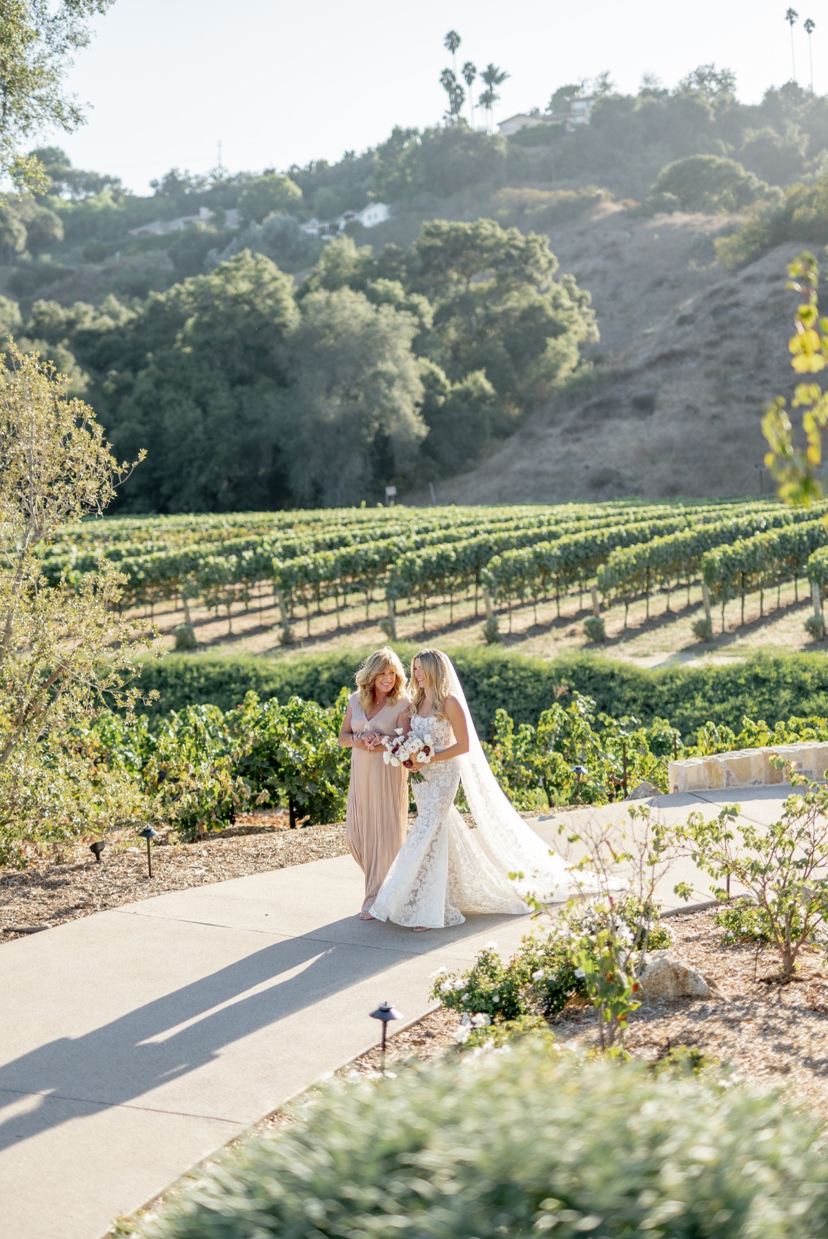 mother walking bride down the aisle