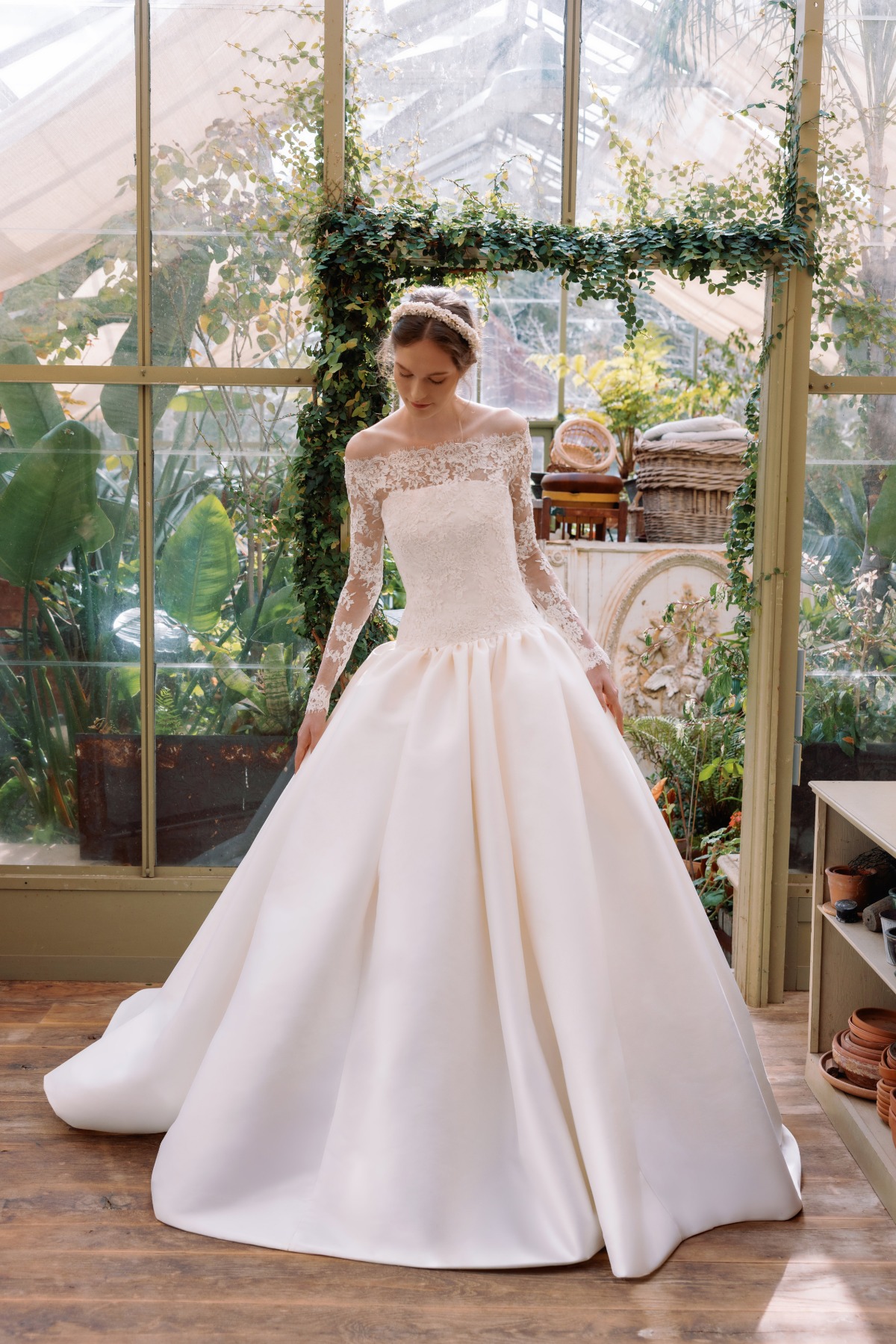 bride wearing ball gown with lace long sleeve