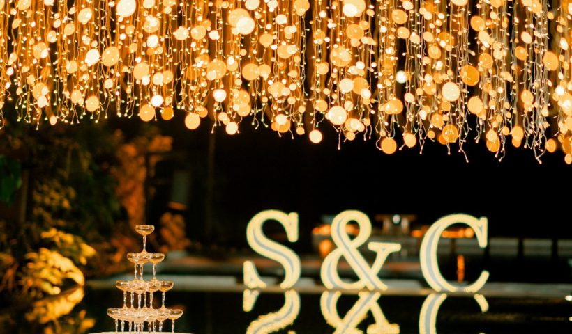 Red rose themed wedding with a dramatic aisle overlooking Phuket