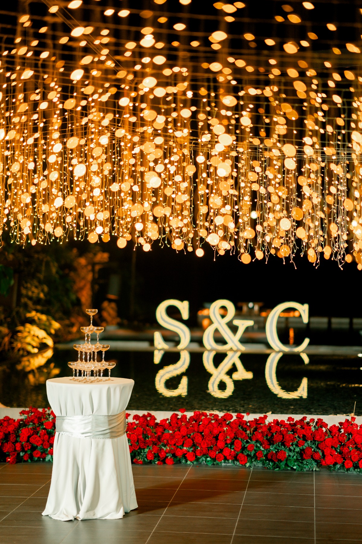 Red rose themed wedding with a dramatic aisle overlooking Phuket