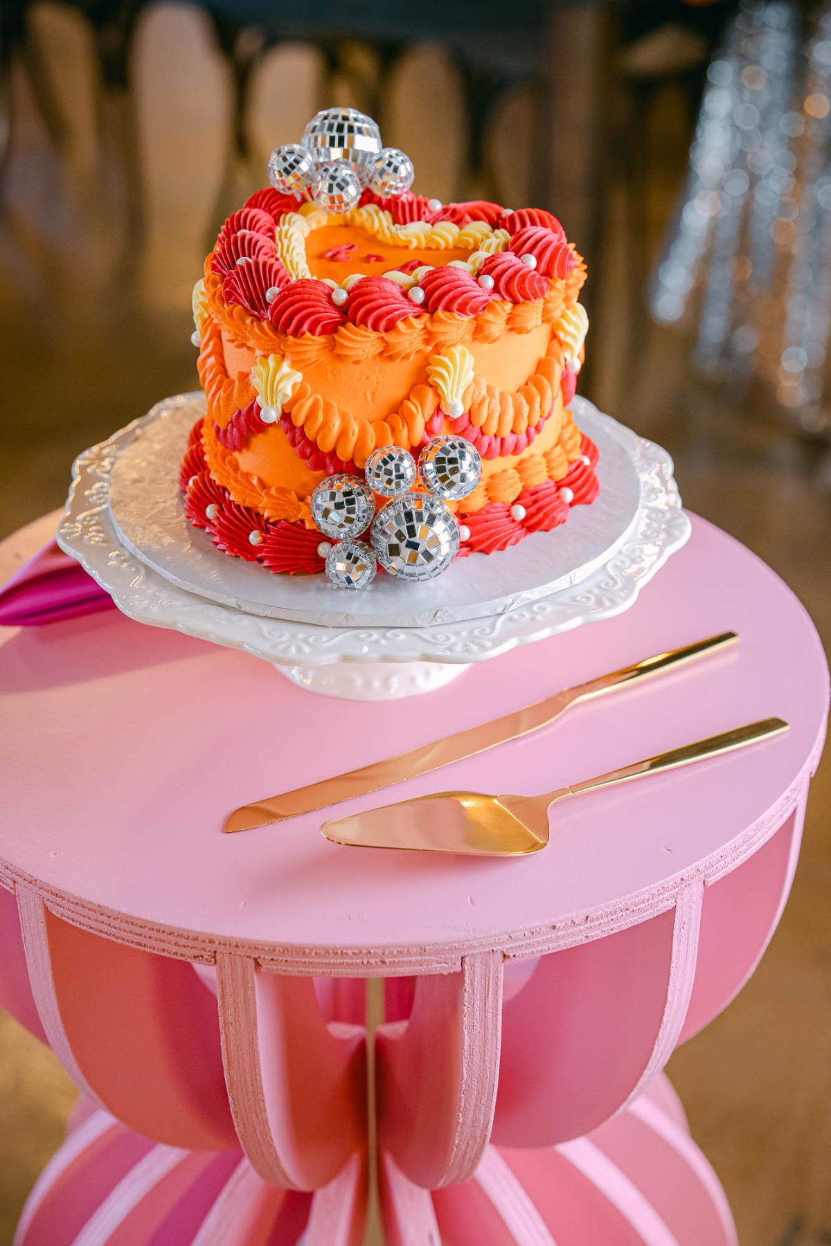 orange and red disco heart wedding cake
