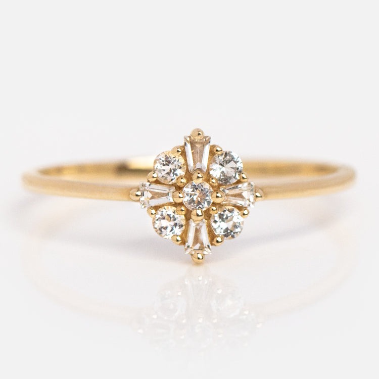 delicate diamond flower engagement ring