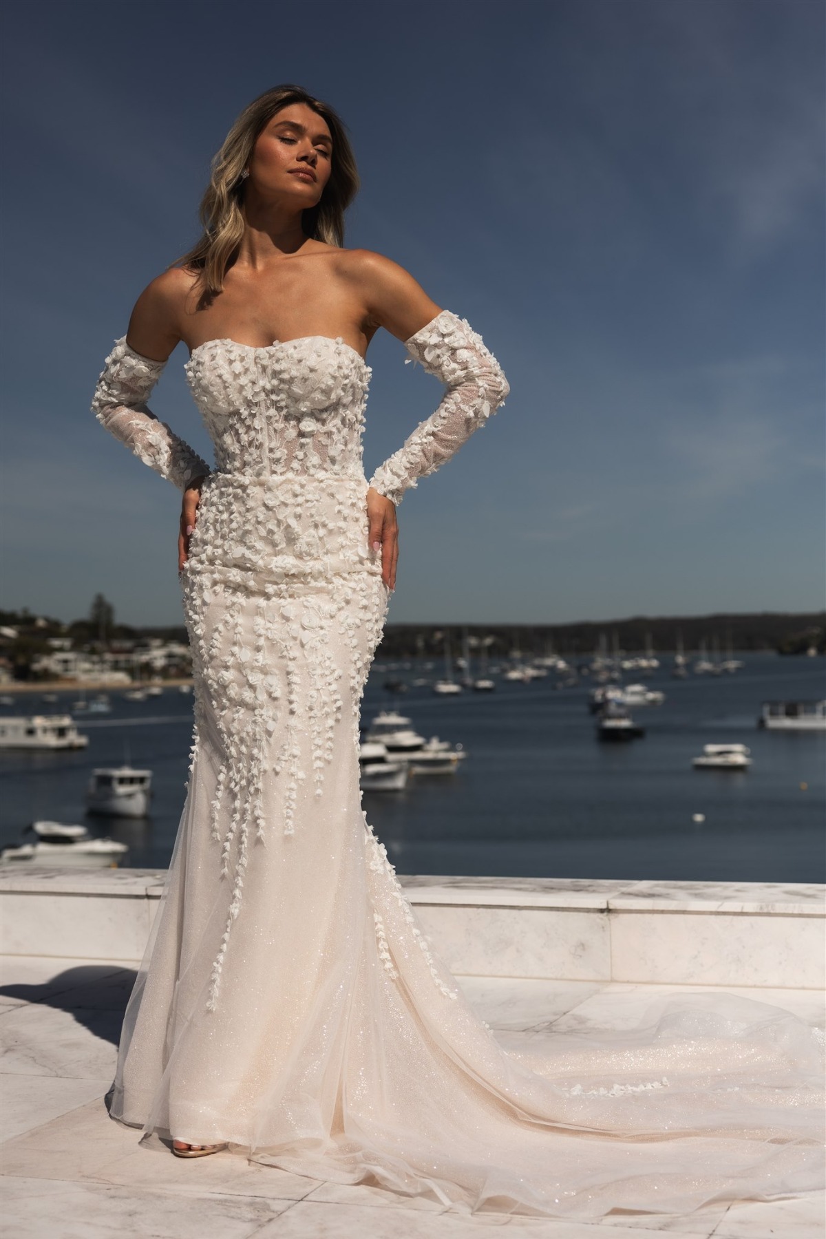 bride wearing unique stralpess gown with gloves