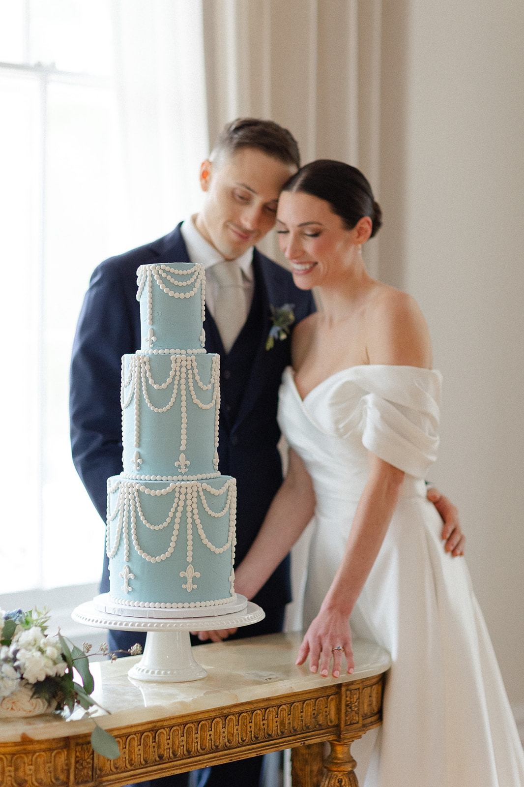blue wedding cake with white pearls