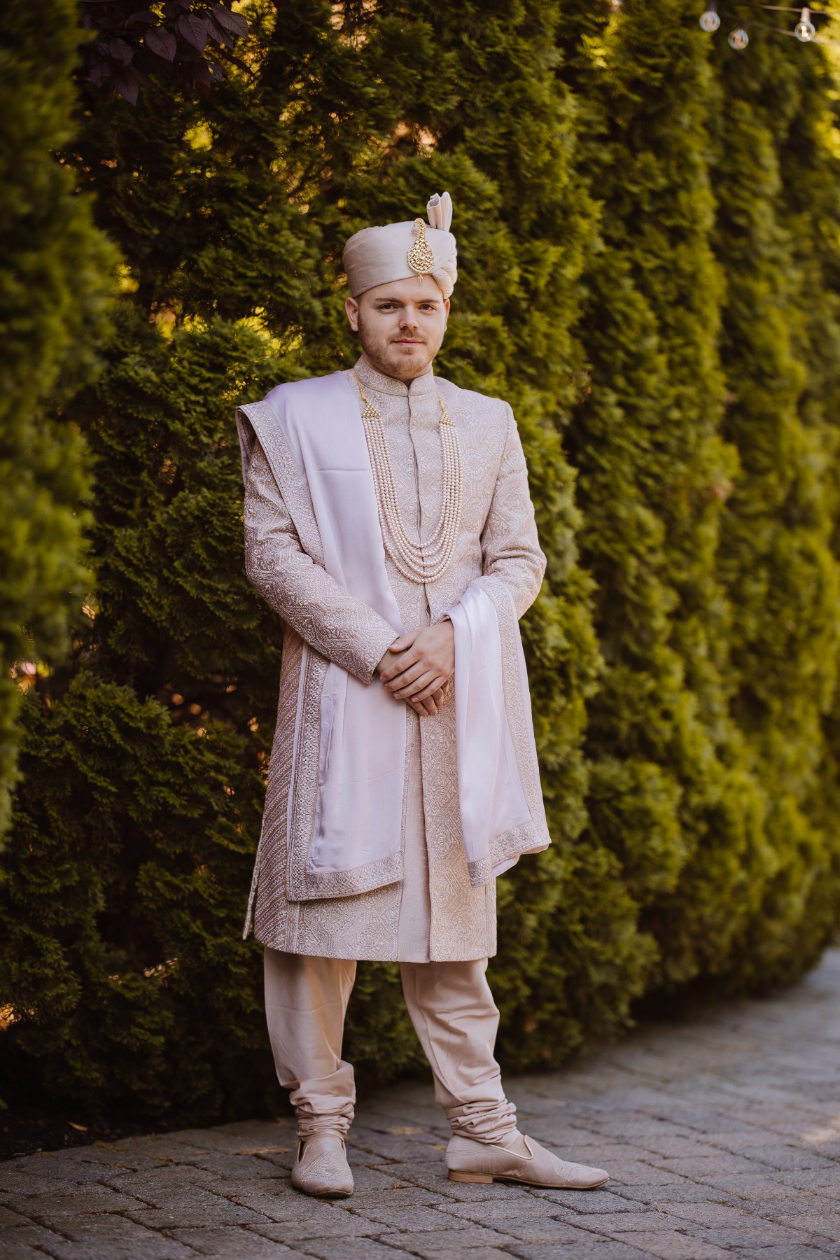 indian groom in ivory attire