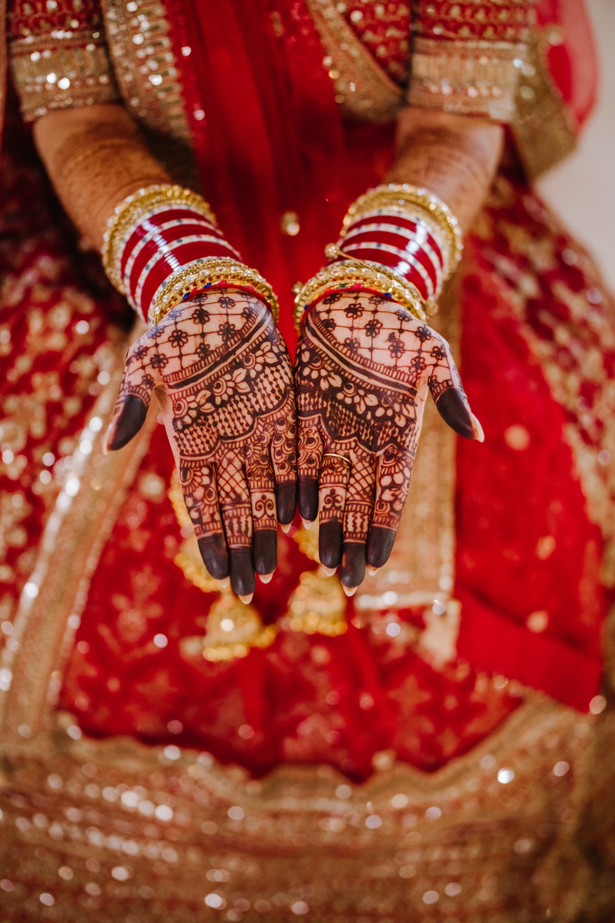 bride in red with henna