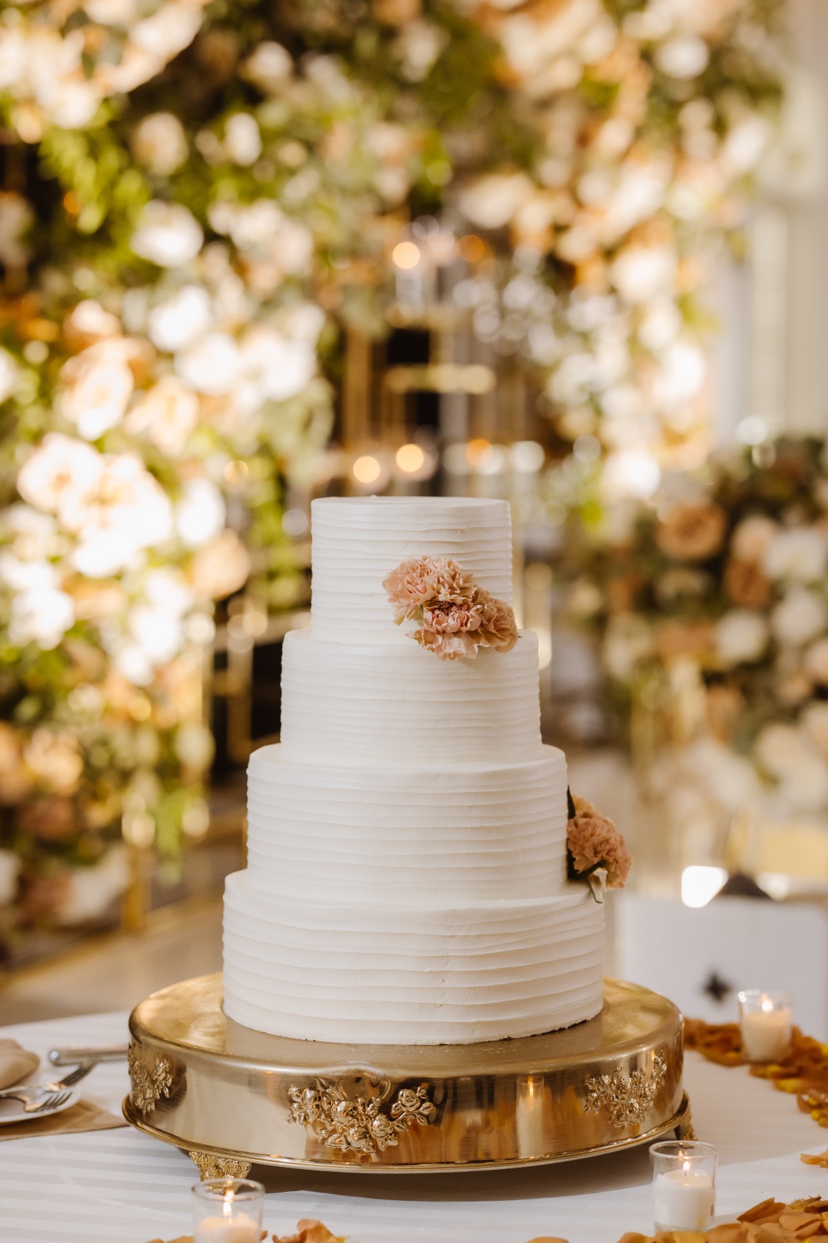 simple buttercream wedding cake with carnations