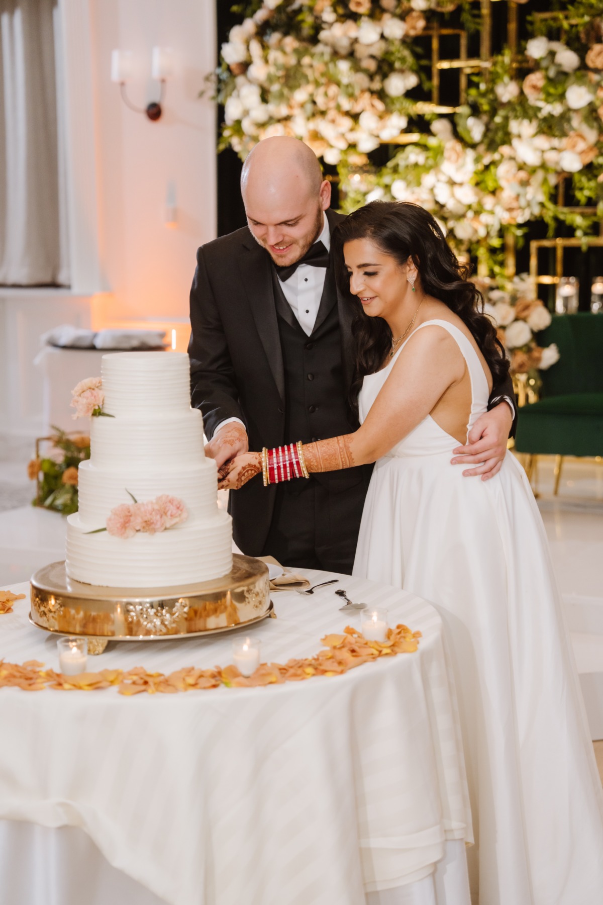 bride and groom cutting wedding cake