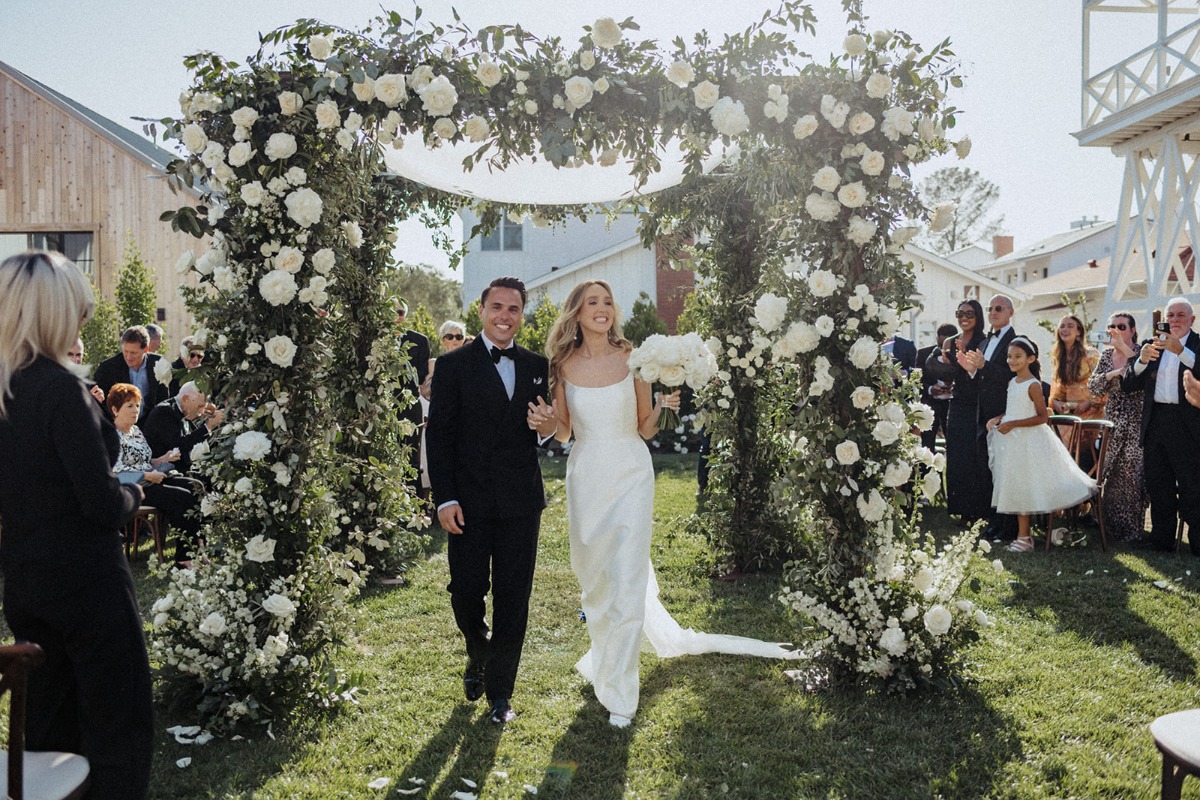 white rose and greenery chuppah