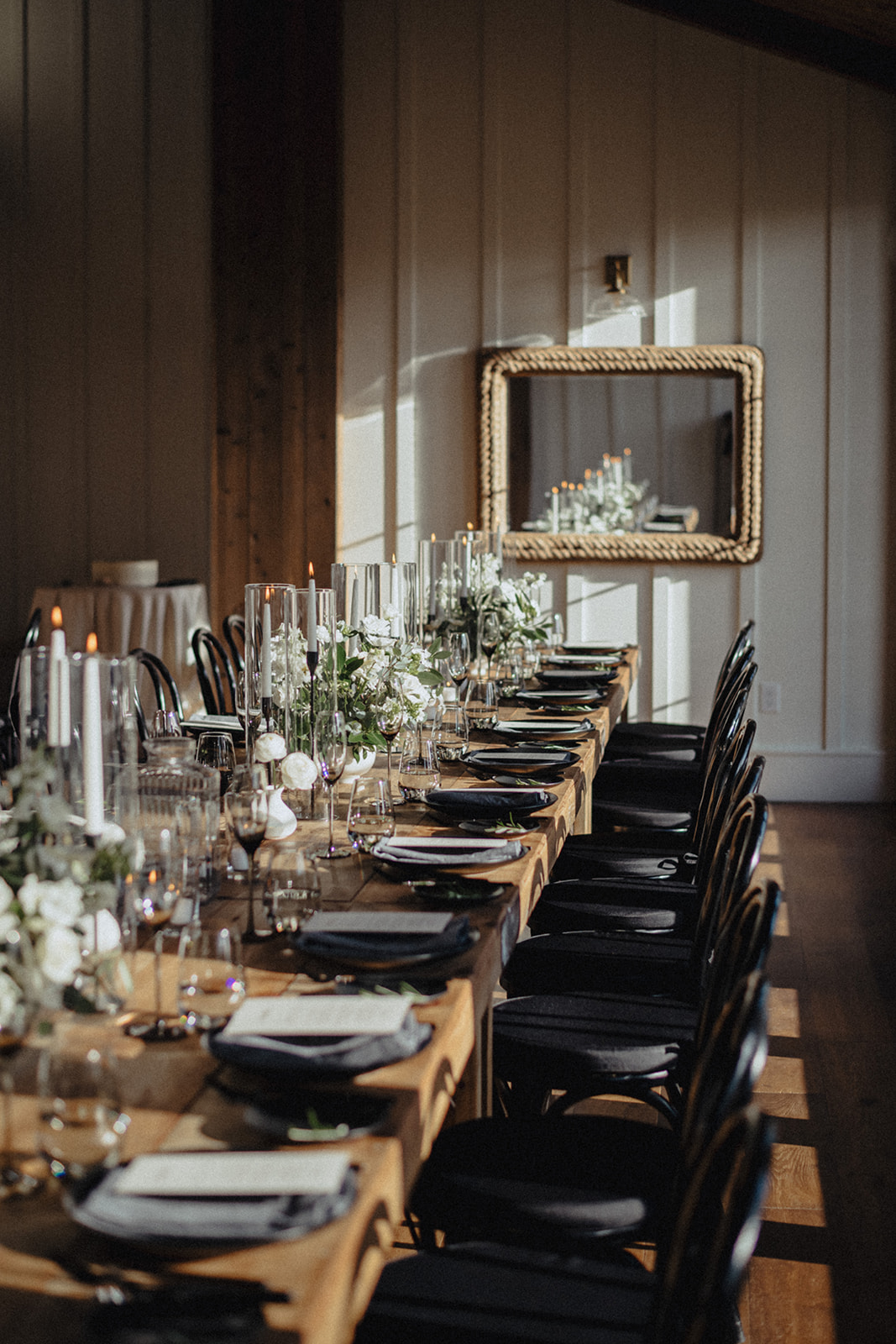 farmhouse table with black place settings