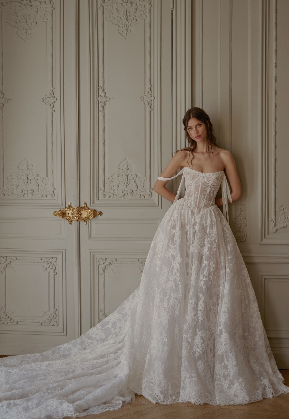 bride wearing lace wedding dress ballgown with basque waist