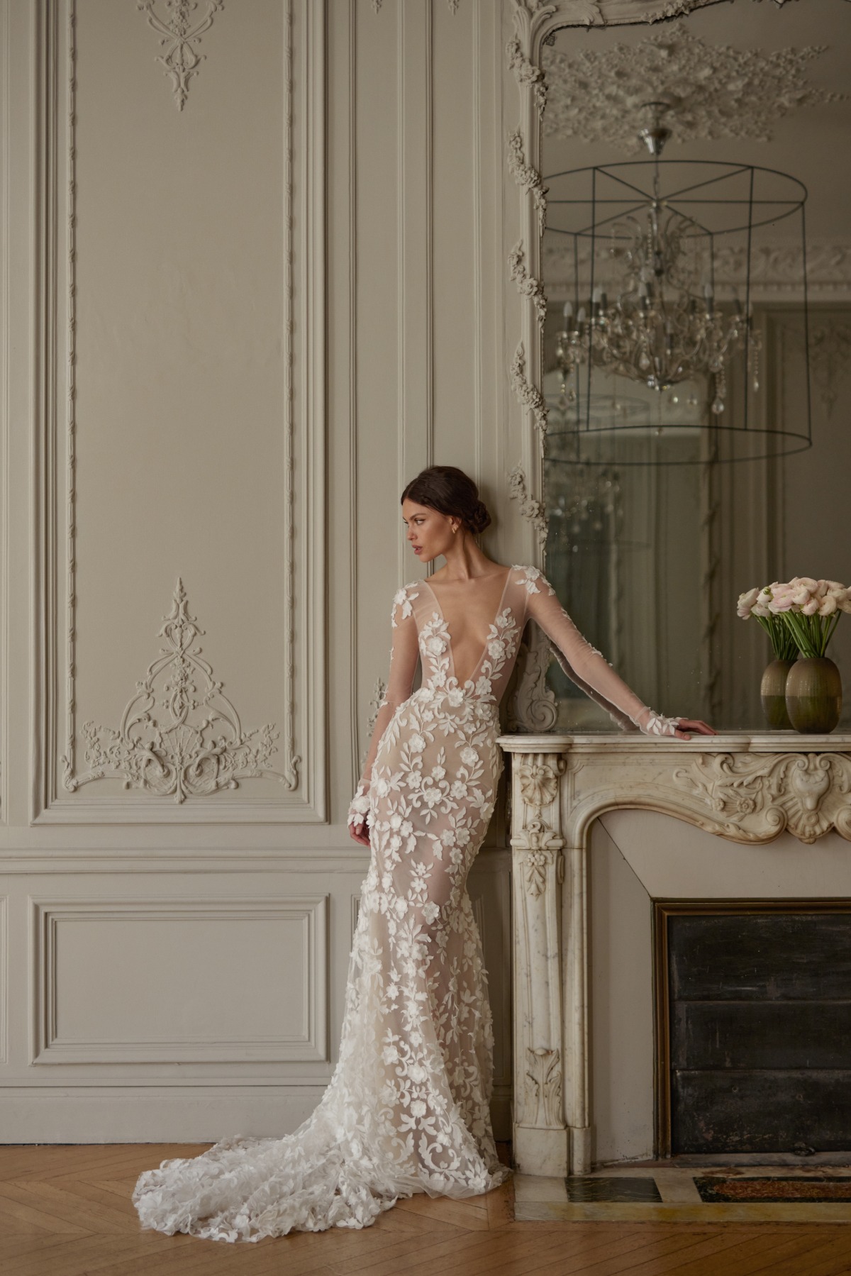 bride wearing long sleeve sheer wedding dress that's fitted