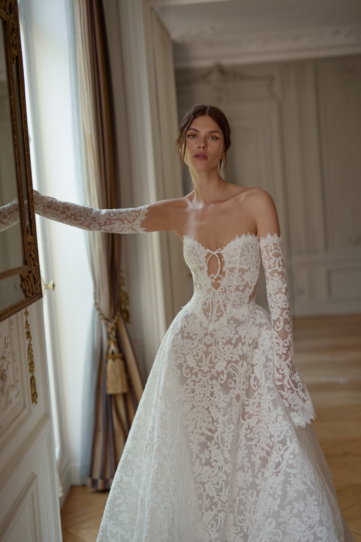 bride wearing strapless ballgown with lace and gloves