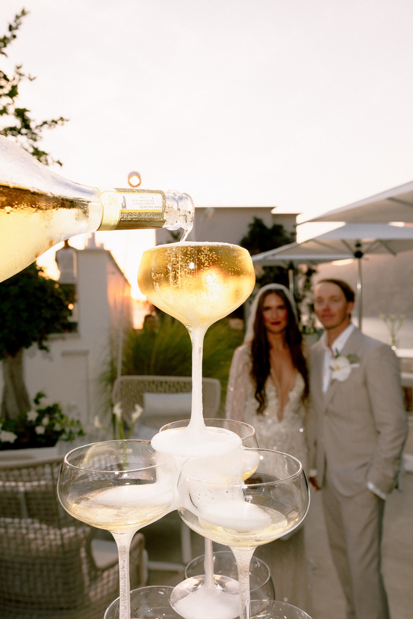 bride wears galia lahav for champagne toast
